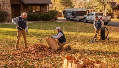 Technicians performing fall leaf removal and yard cleanup in Flagstaff, AZ for Chop Chop Landscaping